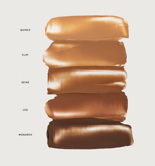 Five vertical makeup swatches in warm brown and bronze shades labeled Quince, Clay, Seine, Leo, and Monarch on a light gray background.